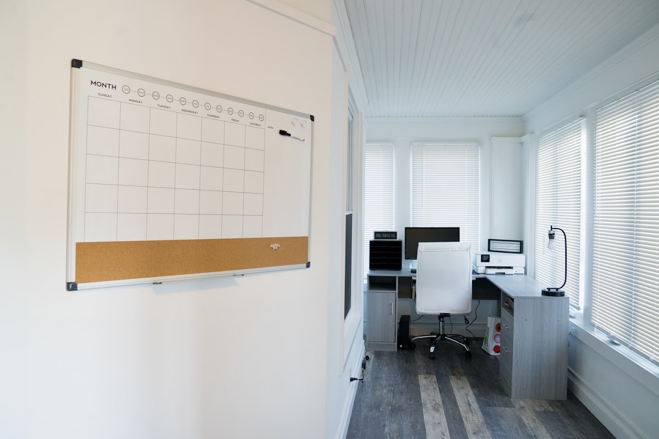 Bright home office with a desk and planning board